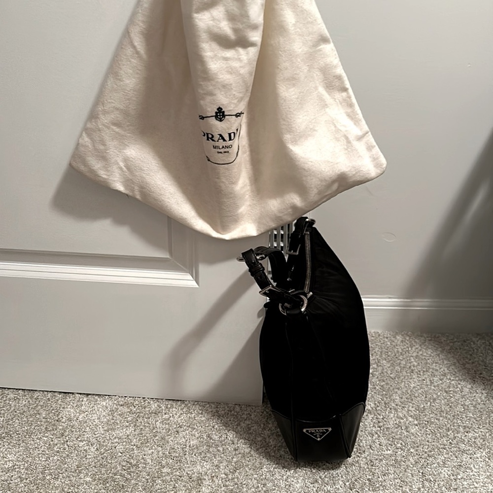 Prada black hobo Tessuto black nylon. Leather corners. Logo on side. adj strap